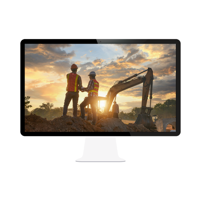 Desktop computer shows a scene with several construction workers in safety gear outside with heavy earth-moving equipment beside them.